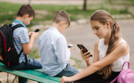 Kids and teens using cellphones